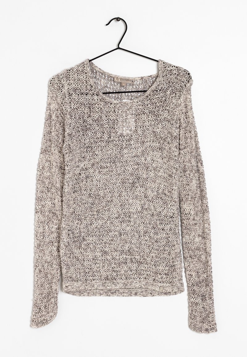 Kevyt, pitkähihainen neule pehmeästä, avonaisesta neuleesta. Neutraali beige, löysä malli ja pyöreä pääntie. Minimalistinen muotoilu yksinkertaisella tekstuurilla.