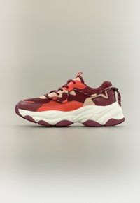 Sporty sneakers in burgundy, orange, and cream. Mesh and synthetic upper with textured panels. Thick white midsole with curved design.