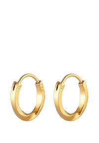 Boucles d'oreilles en forme de créole plaqué or avec une surface lisse et un éclat subtil. Caractérisées par une fermeture à clip sécurisée et une forme ovale. Bénifient du marquage "375" pour assurer leur qualité.