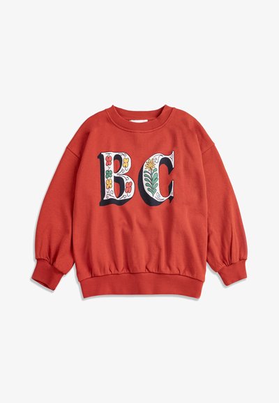 Felpa a maniche lunghe color ruggine con grandi lettere decorative "B" e "C" con motivi floreali colorati sul davanti.