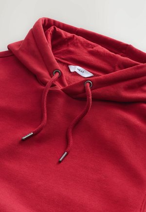 Rode katoenen hoodie met een trekkoord met zilveren metalen aglet en een zachte binnenvoering. Het label zegt "NEXT."