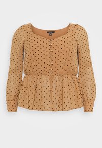 Hnědá blůza s puntíky s čtvercovým výstřihem, dlouhými nabíranými rukávy, zapínáním na knoflíky a peplum spodním okrajem. Vyrobena z lehké, texturované látky.