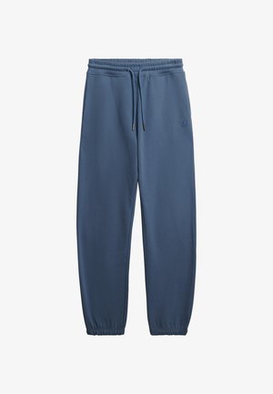 Niebieskie spodnie dresowe z elastycznym pasem i sznurkiem, bocznymi kieszeniami, elastycznymi ściągaczami oraz subtelnym logo na lewym udzie.
