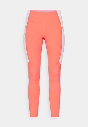 Koral sportslige tights med høy midje, med hvite sidedele og buede sømmer. Glatt tekstur med kontrasterende sømdetaljer.
