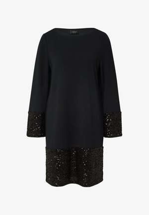 Zwarte jurk met driekwart mouwen, met paillettenaccenten op de mouwen en de zoom. Glad materiaal, relaxte pasvorm, bateau halslijn.