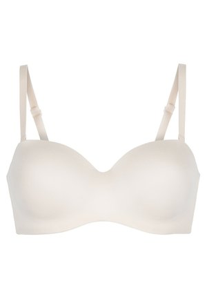 Beige geformter BH mit glatten Cups, verstellbaren Trägern und nahtlosem Design. Verfügt über ein U-förmiges Mittelteil für verbesserten Sitz und Komfort.