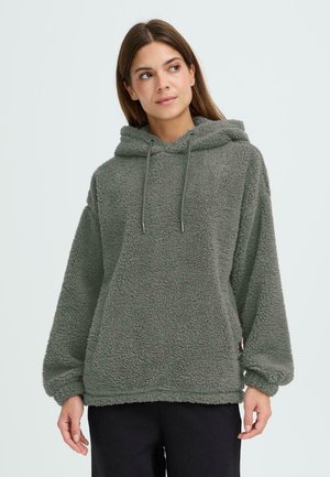 Fleece hoodie i olivgrön med en strukturerad, fluffig yta, justerbar dragsko-hood och sidofickor; lös passform med vida ärmar.