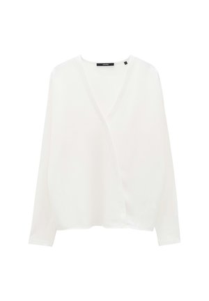 Witte lange mouwen top met een diepe V-hals, losse pasvorm en zachte textuur. Bevat een labeldetail bij de kraag.