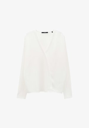 Witte lange mouwen top met een diepe V-hals, losse pasvorm en zachte textuur. Bevat een labeldetail bij de kraag.