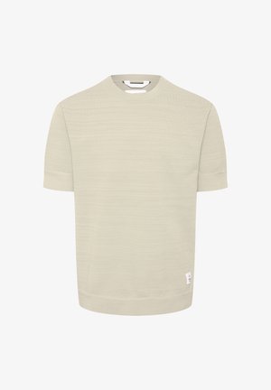 Svetlo zelena kratkovlaka majica s teksturiranim vzorcem, okroglo ovratnikom in majhno belo etiketo na robu. Mehka bombažna mešanica.