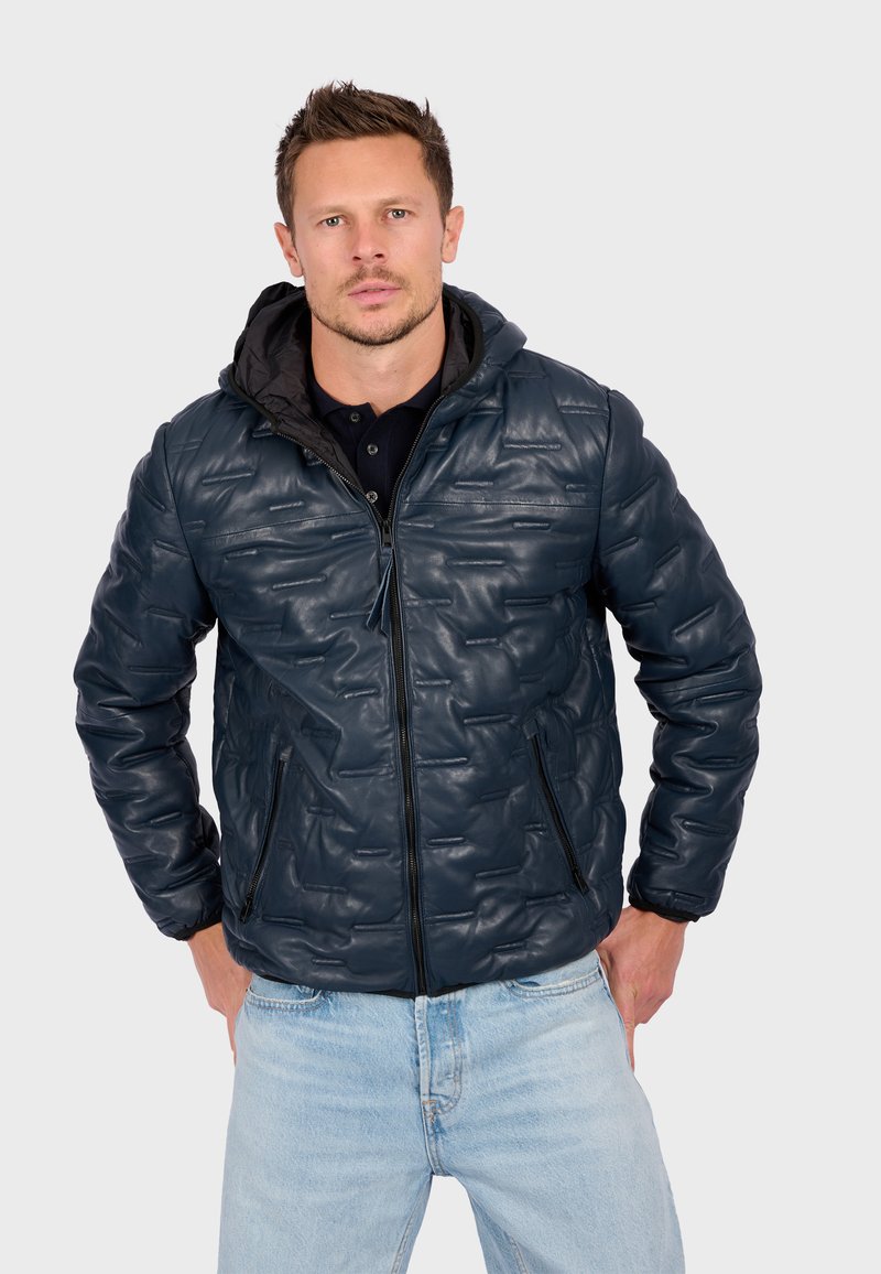 Blue puffer jacket featuring a quilted design, zippered front, two side pockets, and a black hood. Made from a glossy, textured material.