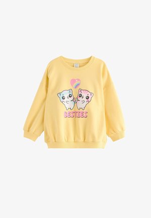 Gelber Sweatshirt mit Illustrationen von zwei niedlichen Katzen, die Pfoten halten, unter einem Herz mit Regenbogen, und dem Wort "BESTIES" in pinken Buchstaben.