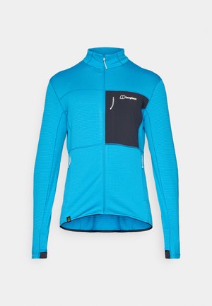 Blue long-sleeve jacket with a textured pattern, zip front, black chest pocket, and contrasting cuffs. Features a stand-up collar and side zippers.