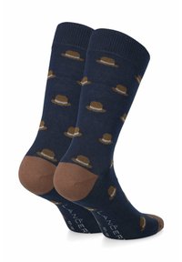 Granatowe skarpetki z brązowymi akcentami, z powtarzającym się wzorem kapeluszy. Gładka tekstura, długość do połowy łydki, z wzmocnioną piętą i palcem.