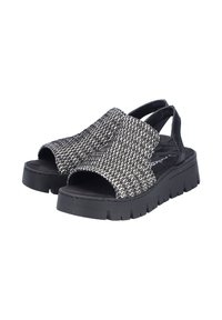 Sandales en tissu tissé noir et blanc avec bout ouvert, bride élastique et semelle en caoutchouc noir épaisse avec motif de bande de roulement texturé.