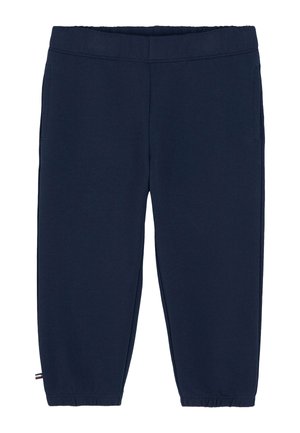 Pantalon de survêtement court bleu marine avec taille élastique et bordures aux chevilles, doté de poches latérales et d'une petite étiquette drapeau près de l'ourlet.