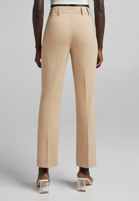 Bershka Tygbyxor - tan