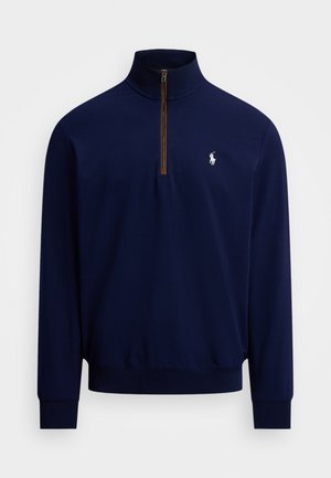 Navy blue long-sleeve pullover with quarter-zip and white embroidered horse and rider logo on left chest.
