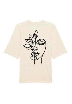 T-shirt in cotone crema con un disegno a linee nere di un volto con foglie, maniche corte e una vestibilità rilassata.