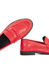 Red leather loafers with textured crocodile pattern, flexible black sole, and raised stitching along the edges. Accented with gold hardware.