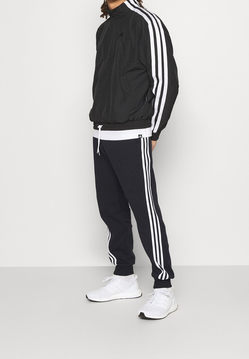 adidas Performance Pantalon de survêtement black/noir (Seconde