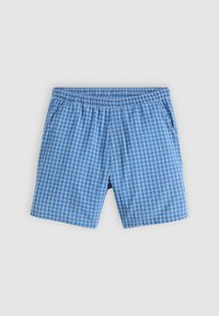 Shorts à taille élastique bleus avec un motif à carreaux blancs et des poches latérales, posés à plat sur un fond gris clair.