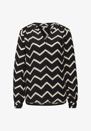 Blouse noire avec un motif en zigzag crème. Fabriquée en tissu léger, elle possède un col en V, une fermeture à boutons et des manches longues.