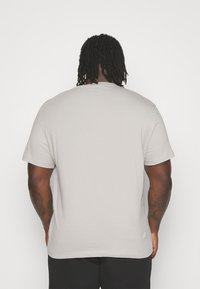 Calvin Klein Jeans Plus MONOLOGO TEE - Basic T-shirt - porpoise