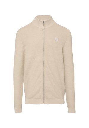 Beige ritsjack met een hoge kraag, ribbelstructuur, lange mouwen en een klein logo op de borst. Gladde stofafwerking.