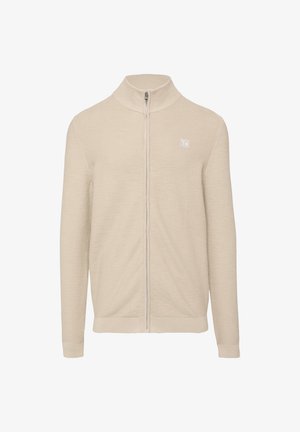 Beige ritsjack met een hoge kraag, ribbelstructuur, lange mouwen en een klein logo op de borst. Gladde stofafwerking.