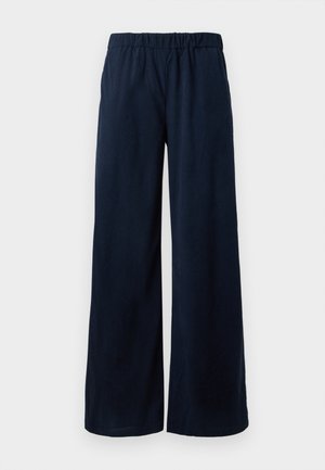 Calças de cordura de perna larga, azul-marinho, com um cós elástico, exibidas sobre um fundo branco.