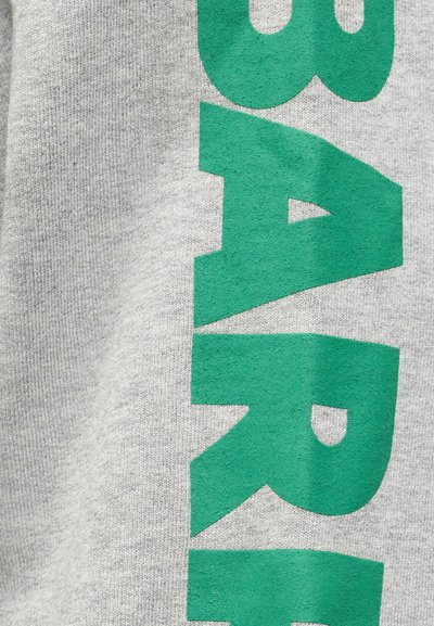 Green block letters spelling "BAR" vertically on a light gray textured fabric background.