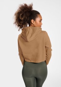 Hummel HMLLEGACY CROPPED  - Sweat à capuche - tigers eye