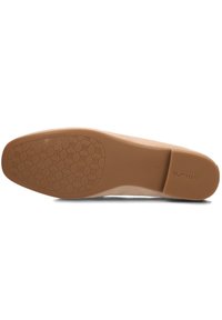 Beige schoenzool met een gladde afwerking, voorzien van een patroon voor grip en een lichte hak. Gemarkeerd met het merk "Unisa" en maat "38."