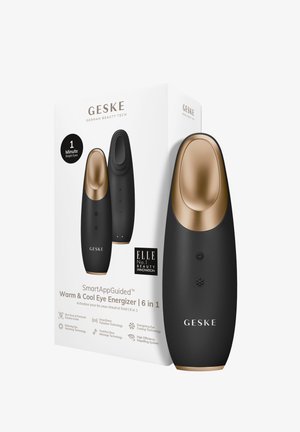 Warme en koele ooggenerator met een slank zwart lichaam en gouden accenten. Compact ontwerp, met knoppen voor temperatuurregeling en LED-indicatoren.
