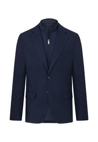 Marineblå blazer med et struktureret stof, to knapper, haklappelukninger og krave med lynlås. Har forlommer og en skræddersyet pasform.