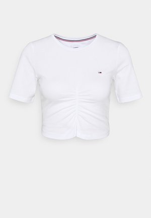 T-shirt bianca a maniche corte corta con arricciatura centrale davanti e piccolo logo Tommy Hilfiger sul petto sinistro.