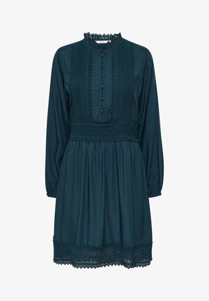 Tengerzöld ruha hosszú ujjakkal, csipkés díszítéssel és gombos záródással. Feszes derékkal és teljes szoknyával rendelkezik, puha anyagból készült.