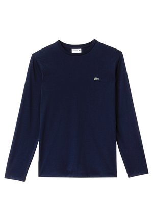 Navy lange mouw t-shirt van katoen, voorzien van een ronde hals en een klein groen krokodillenlogo op de borst. Gladde textuur, klassieke pasvorm.