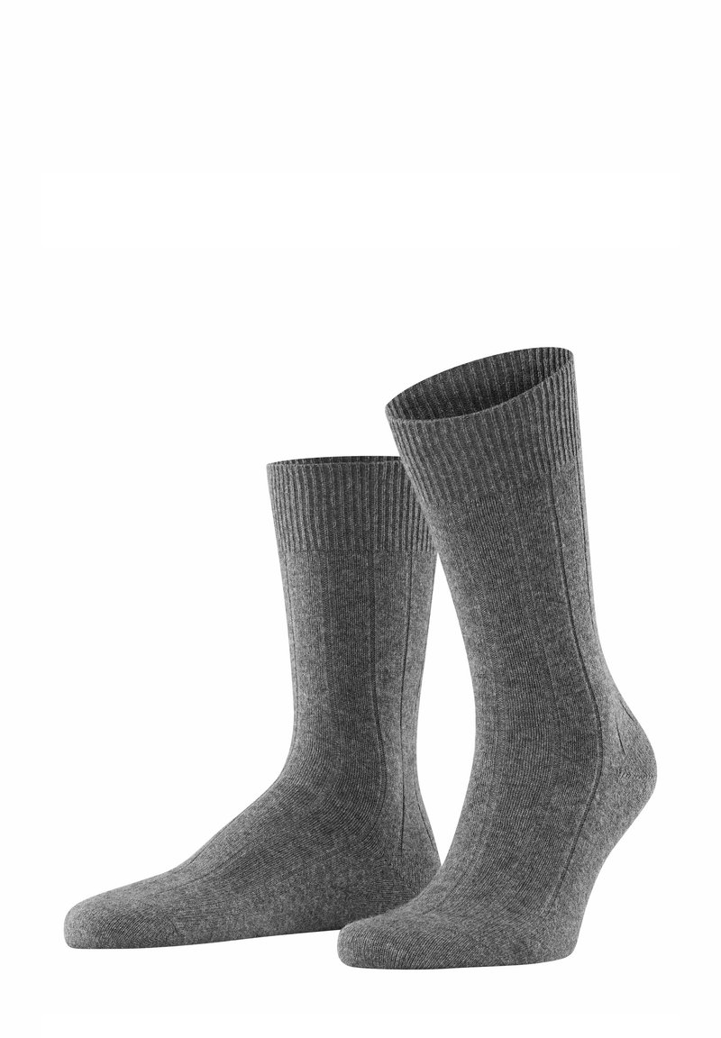 Graue gerippte Socken mit glatter Textur, knöchelhohem Design und verstärktem Zehenbereich. Besitzen ein dezentes Muster an der Seite für zusätzliche Details.