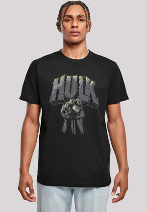 Black cotton t-shirt featuring a graphic design of a fist and the text "HULK" in bold, jagged letters with gray and green accents.
