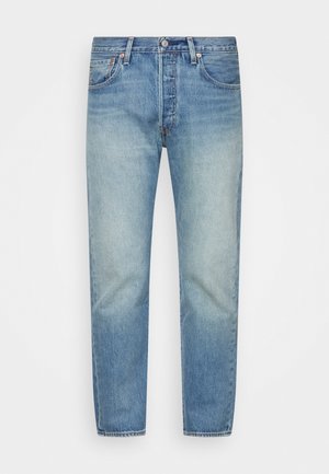 Light blue denim jeans with a faded finish, straight cut, classic five-pocket design, and metal rivets. Unfinished hem at the bottom.