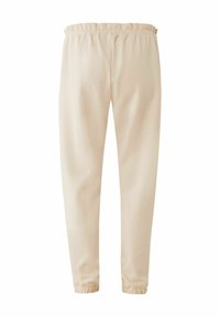 Beige joggers met elastische taille en taps toelopende benen met elastische boorden. Gladde stof met geen zichtbare patronen of hardware details.