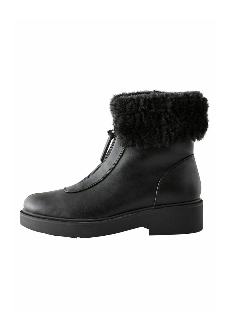 Black leather ankle boot featuring a textured faux fur cuff, a smooth finish, rounded toe, and a chunky sole for stability.