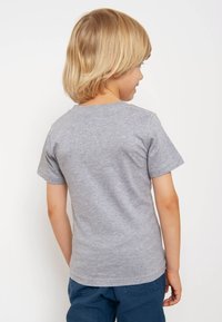 Gray cotton t-shirt with a crew neck and short sleeves. Smooth texture, simple design, and a relaxed fit. No visible patterns or accents.