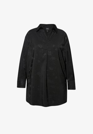 Camicia nera a maniche lunghe in tessuto morbido, caratterizzata da un delicato motivo floreale e un colletto, con polsini abbottonati.