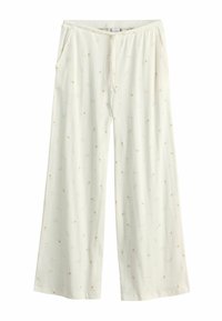 Pantalon large crème avec taille à cordon et imprimé floral subtil dans des tons roses doux et beige.
