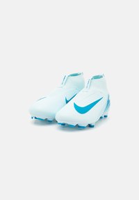 White soccer cleats with light blue accents, featuring a sleek design, high ankle, and textured surface. Studded synthetic sole for traction.