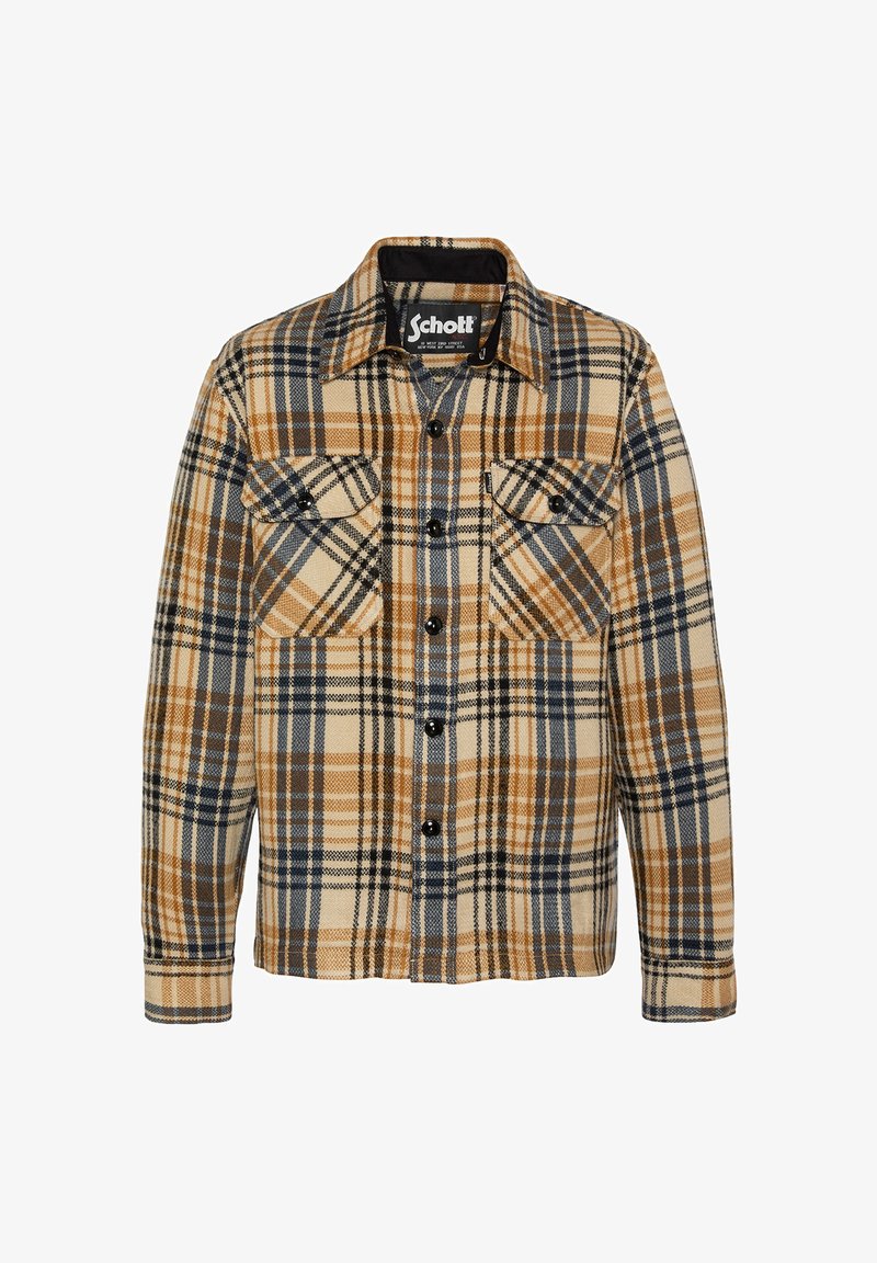 Chemise en flanelle à carreaux beige, marron et bleu marine. Comprend deux poches avant, des boutons noirs et un col classique. Tissu texturé.