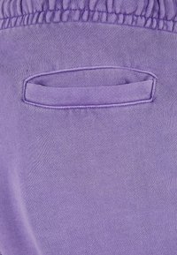 Karl Kani Jogginghose - lila